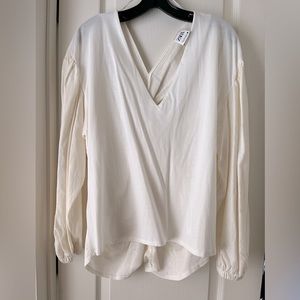 Cream colored linen blouse.